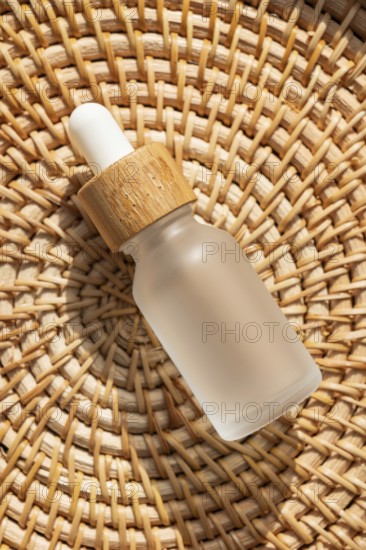 A cosmetic with a wooden cap is placed on a woven rattan mat. The warm lighting emphasizes the natural materials, making it ideal for eco friendly product presentations