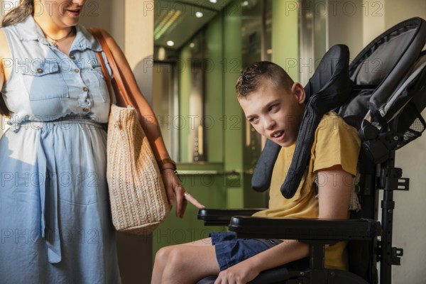 A mother lovingly supports her son with cerebral palsy in a wheelchair. Sunlight highlights their connection as they navigate daily life with strength and care