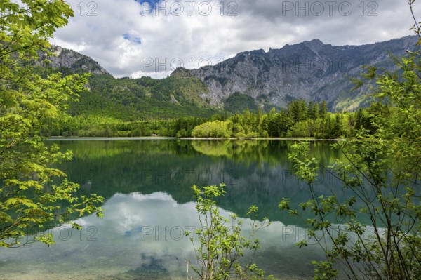 Landscape of Lake Offensee after rain when the sun comes through the clouds in spring, Salzkammergut, Austria