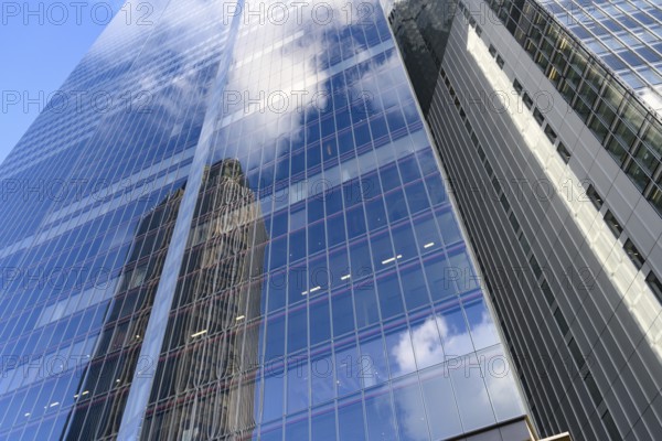 Modern abstract reflections in glass fronted commercial office buildings in the financial district of the British capital London