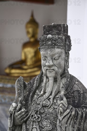 Stone statue of a Chinese warrior, guardian, Wat Pho, Temple of the Reclining Buddha, Bangkok, Thailand