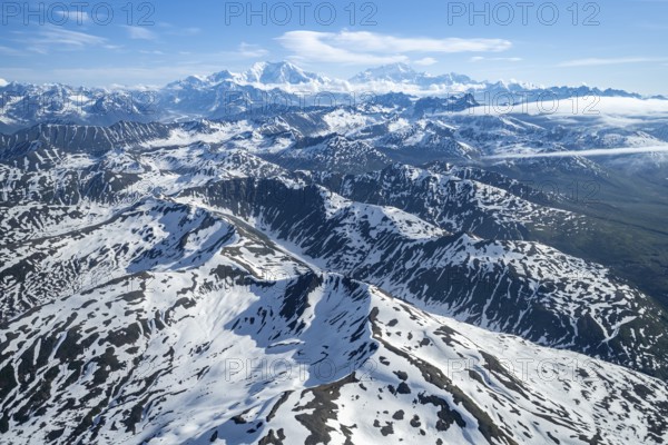 Clouds over high mountains, Mt Foraker and Mt Denali or Mount McKinley, aerial view, Alaska Range, Denali National Park, Alaska, USA