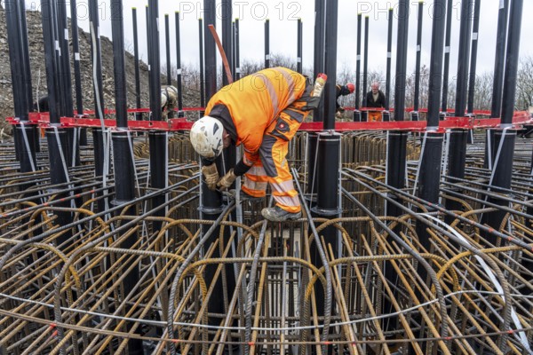 Assembly of reinforcing steel for the reinforced concrete foundation of a wind turbine, a mesh of rebar and rebar mesh, over 100 tons of reinforcing steel were used, the wind turbine will have a hub height of 160 meters, part of a new wind farm in Sauerland, near Balve, North Rhine-Westphalia, Germany