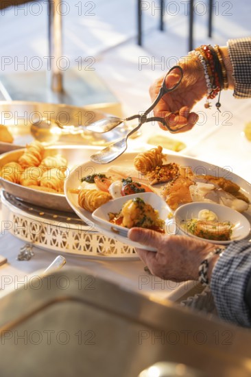 A fine buffet in the restaurant is lovingly presented under a lamp, Europäischer Hof, Königsbach Stein, Germany
