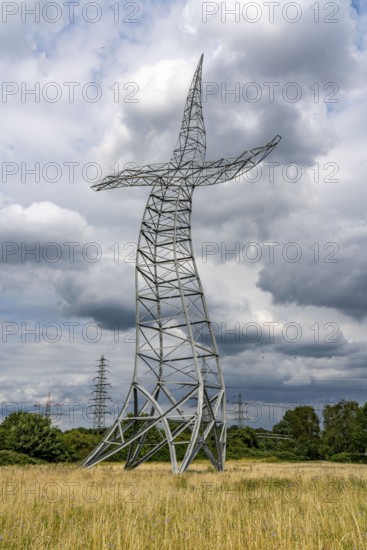 Emscherkunst, artwork Zauberlehrling by the Berlin artist group Inges Idee, an apparently dancing electricity pylon, 35 metres high, in a meadow near Haus Ripshorst in Oberhausen, North Rhine-Westphalia, Germany