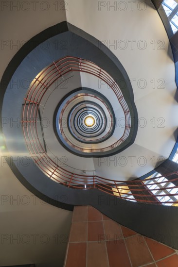 Dizzying view through a spiral staircase with red and black elements, SPRINKENHOF, Hamburg, Germany