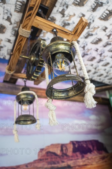 Decorative old lamps on a wooden ceiling