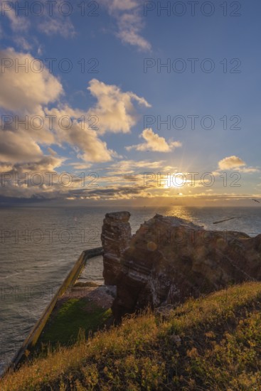 Red red sandstone cliff edge, Heligoland high sea island, Lange Anna, backlight, North Sea, blue sky, Pinneberg district, Schleswig-Holstein, Germany