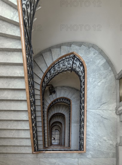 Staircase around 1900 with a wrought-iron banister, in a residential building, Genoa, Italy