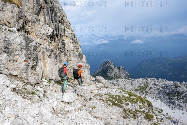 Climbers on a hiking trail, rocky mountain landscape, Via Ferrata SOSAT via ferrata, Brenta Mountains, Trentino, Italy