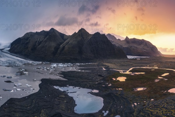 Captivating sunset lighting up the rugged landscape around Vatnajökull Glacier, located within Vatnajökull National Park in Iceland