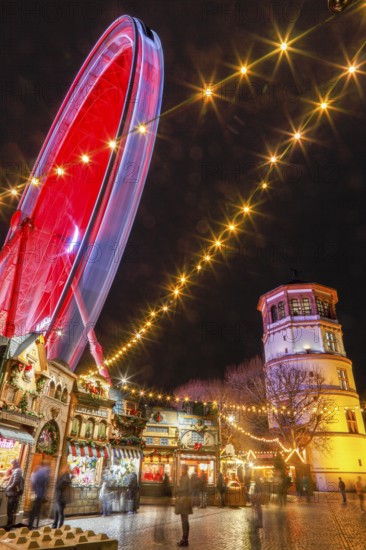 Rhine promenade with Castle Tower and illuminated Ferris wheel at dusk, Dusseldorf, North Rhine-Westphalia, Germany