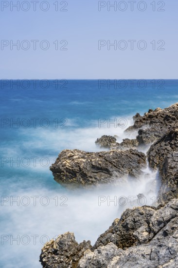 Romantic view over the sea in Koromacna Bay on a sunny day with rough seas on the island of Cres, long exposure, Croatia