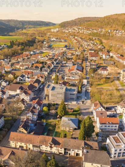 Aerial view of a neighbourhood with houses and streets surrounded by hills, Nagold, Black Forest, Germany