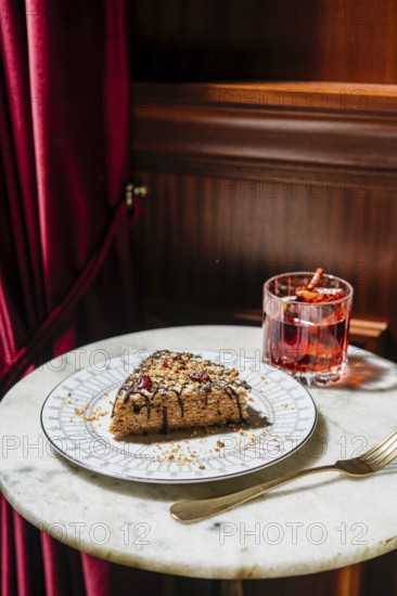 A delectable waffle cake layered with creamy truffle condensed milk, topped with chocolate drizzle, nuts, and dried cherries. Perfect for a luxurious dessert treat