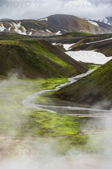 Colourful volcanic landscape with hills and snow, volcanic steaming hot springs, Laugavegur trekking trail, Landmannalaugar, Fjallabak Nature Reserve, Icelandic Highlands, Suðurland, Iceland