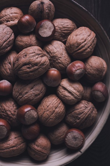 Walnut and hazelnut, close-up, top view, selective focus, toned image, rustic, food background