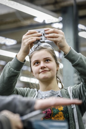 Remscheid, North Rhine-Westphalia, Germany - Trainee woman in metalworking here a materials tester during basic training, Vocational Training Centre of the Remscheid metal and electrical industry. - FOR EDITORIAL USE ONLY!