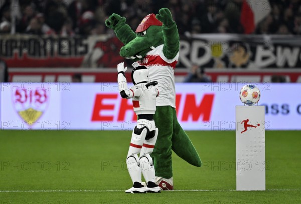 During the DFL and VfB Stuttgart Innovation Matchday, an AI-supported robot hands over the Adidas Derbystar game ball to the mascot Fritzle VfB Stuttgart logo soccer Bundesliga, MHPArena, MHP Arena Stuttgart, Baden-Württemberg, Germany