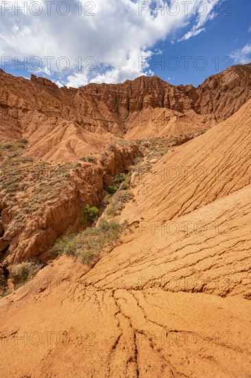 Eroded mountain landscape with sandstone cliffs, canyon with red and orange rock formations, Konorchek Canyon, Chuy, Kyrgyzstan