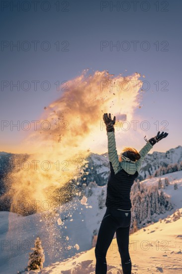 Summit bliss in the snow-covered winter landscape in the Tannheimer Tal in the Alps on the Neunerköpfle, Tyrol, Austria
