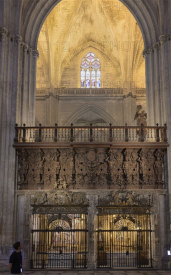 Impressive Gothic church architecture with ornate decorations and light effects, Seville, Andalusia, Spain