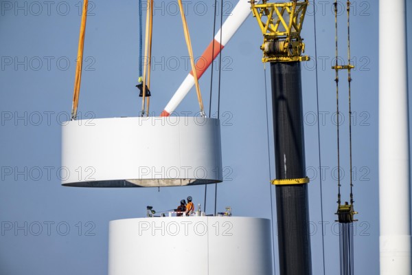 Construction site of the new Bedburg 3 wind farm, on recultivated open-cast mining site, 9 wind power plants with an output of 60 megawatts are being built, installation of the wind turbine tower operated by RWE and the city of Bedburg, North Rhine-Westphalia, Germany