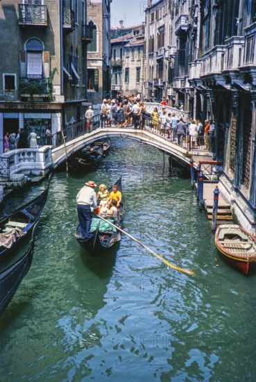 Gondolier gondola boat bridge over the Rio del Palazzo, Venice, Italy 1969