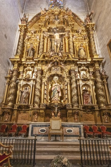 Elaborately designed baroque altar with golden sculptures and decorations, Seville
