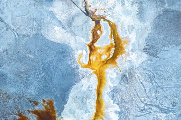 Aerial photo capturing a vibrant, abstract landscape where natural textures and colors mix dramatically