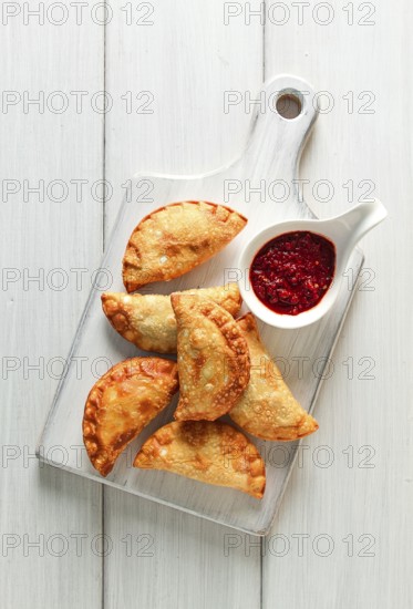 Fried chebureks, close-up, on a light background, no people