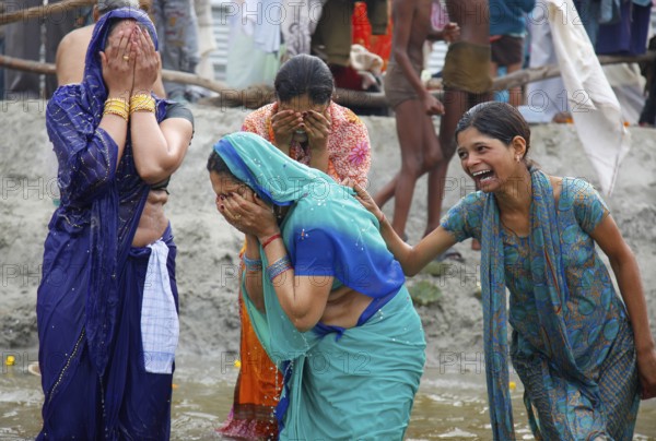 Allahabad, India, 20.01.10 - Hindus meet at Magh Mela in Allahabad to take a holy bath at the Sangam at the confluence of the Ganges, Yamuna and Saraswati rivers. Devotees take holy dip at Sangam. Magh Mela is an annual Hindu ritual hero on the banks of Sangam.The Mela is also known as the mini Kumbh Mela. It is held in the Hindu month of Magh