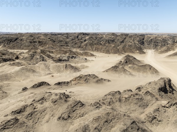 Aerial view, dry barren mountains in Moon Valley, rocky landscape ridged by erosion, Namib-Naukluft Park, Namib Desert, Namibia