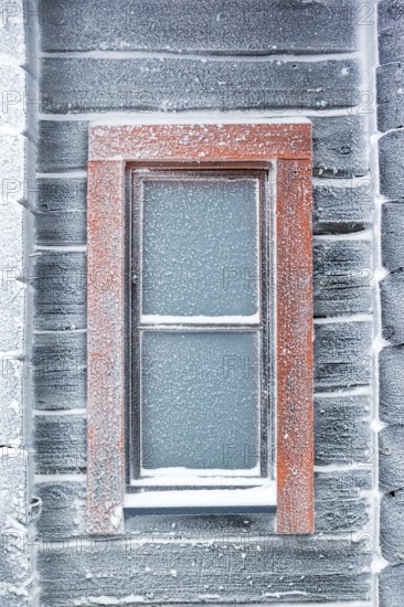 Europe, Finland, Lapland, frozen wooden house, ice window