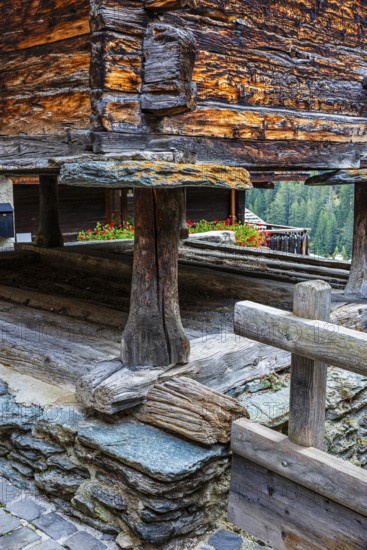 Old barn on wooden supports and stone slabs, historic village centre, Grimentz, Val d'Anniviers, Valais Alps, Canton Valais, Switzerland