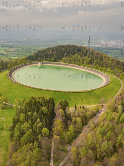 Upper reservoir, view of a water reservoir surrounded by green landscape and forest, Glems reservoir, Swabian Alb, Germany