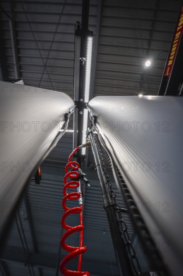 Perspective view of two columns in a workshop with suspension for inner tube, Waldbike Manufaktur, bicycle workshop, Calw, district of Calw, Black Forest, Germany