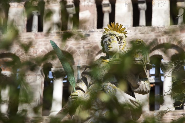 An angel in front of the abbey church St. Stephanus and St. Vitus, Abbey Castle Corvey in Hoexter, Weserbergland, North Rhine Westphalia, Germany