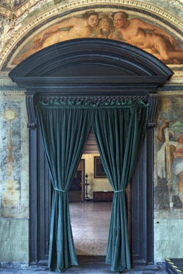 Passageway with velvet curtain in the upper rooms of the Villa del Principe, Palazzo di Andrea Doria, Piazza dei Principe, Genoa. Italy