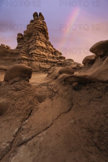 Captivating view of unique sandstone formations under a colorful sky in Goblin Valley State Park, Utah, USA, showcasing natural erosion and stunning landscapes