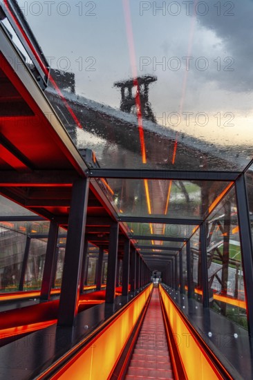 Zeche Zollverein, rainy day, ride on the escalator of the Ruhr Museum, in the coal washing plant, view of the double headframe of shaft XII, through rain-soaked windows, Essen, North Rhine-Westphalia, Germany
