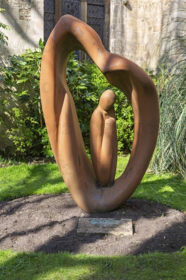 Sculpture by artist Naomi Blake 1980 'Refugee' garden of Bristol cathedral church, Bristol, England, UK