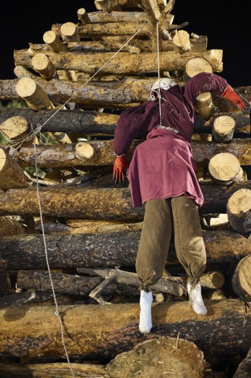 ©Udo Rein, A doll representing the traitor Judas is attached to a pyramid-shaped pile of wood at night, Easter bonfire Psinthos, Holy Saturday, Easter, Psinthos, Rhodes, Dodecanese, Greek Islands, Greece