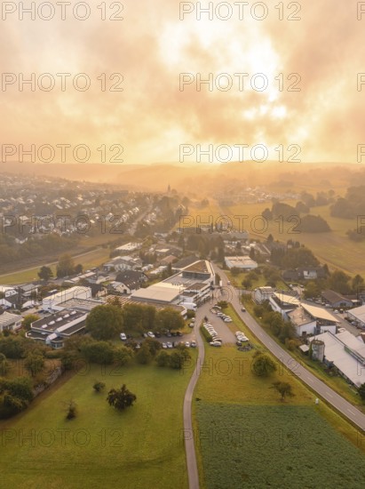 Wide panoramic view of a village at sunrise with green surroundings, Gechingen, Black Forest, Germany