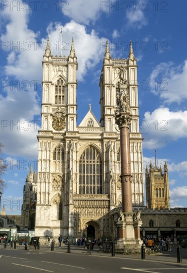 Towers and frontage of Westminster abbey church with Victoria Tower in background, Westminster, London, England, UK