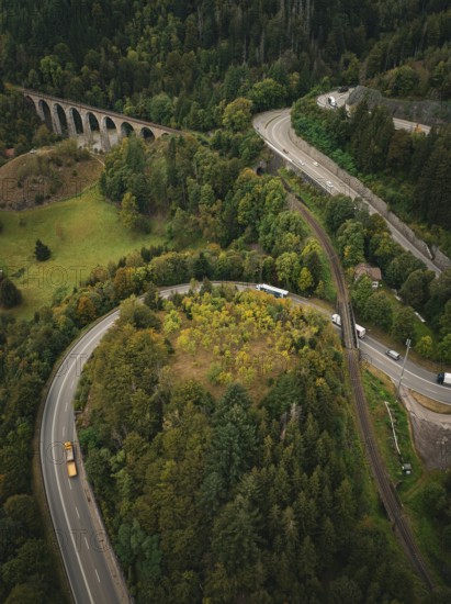 Winding road surrounded by forest and viaduct, Ravenna Gorge, Black Forest, Germany
