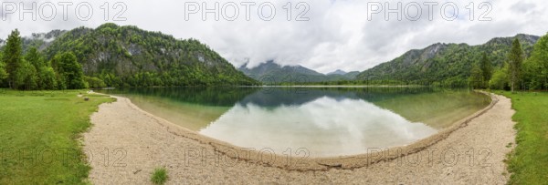 Landscape of Lake Offensee after rain when the sun comes through the clouds in spring, Salzkammergut, Austria