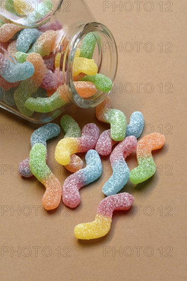 Lots of colorful jelly sweets with glass containers