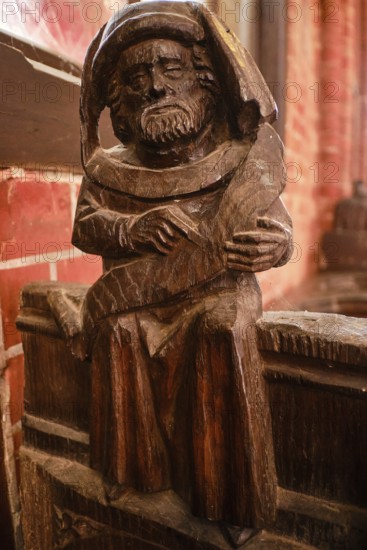 Carved wooden figures on Gothic choir stalls, Nikolaikirche Hanseatic City of Wismar, Mecklenburg-Western Pomerania, Germany
