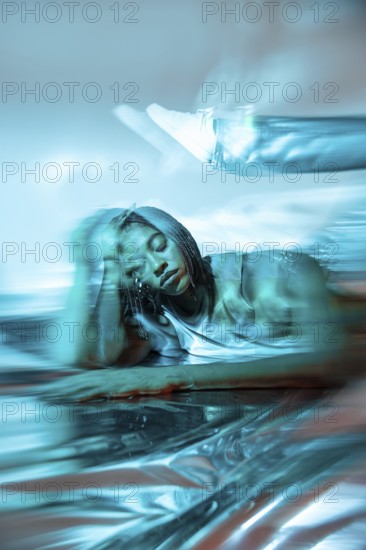 A futuristic African young woman immersed in the digital metaverse, showcasing a blend of technology and culture. The scene is vibrant with holographic elements